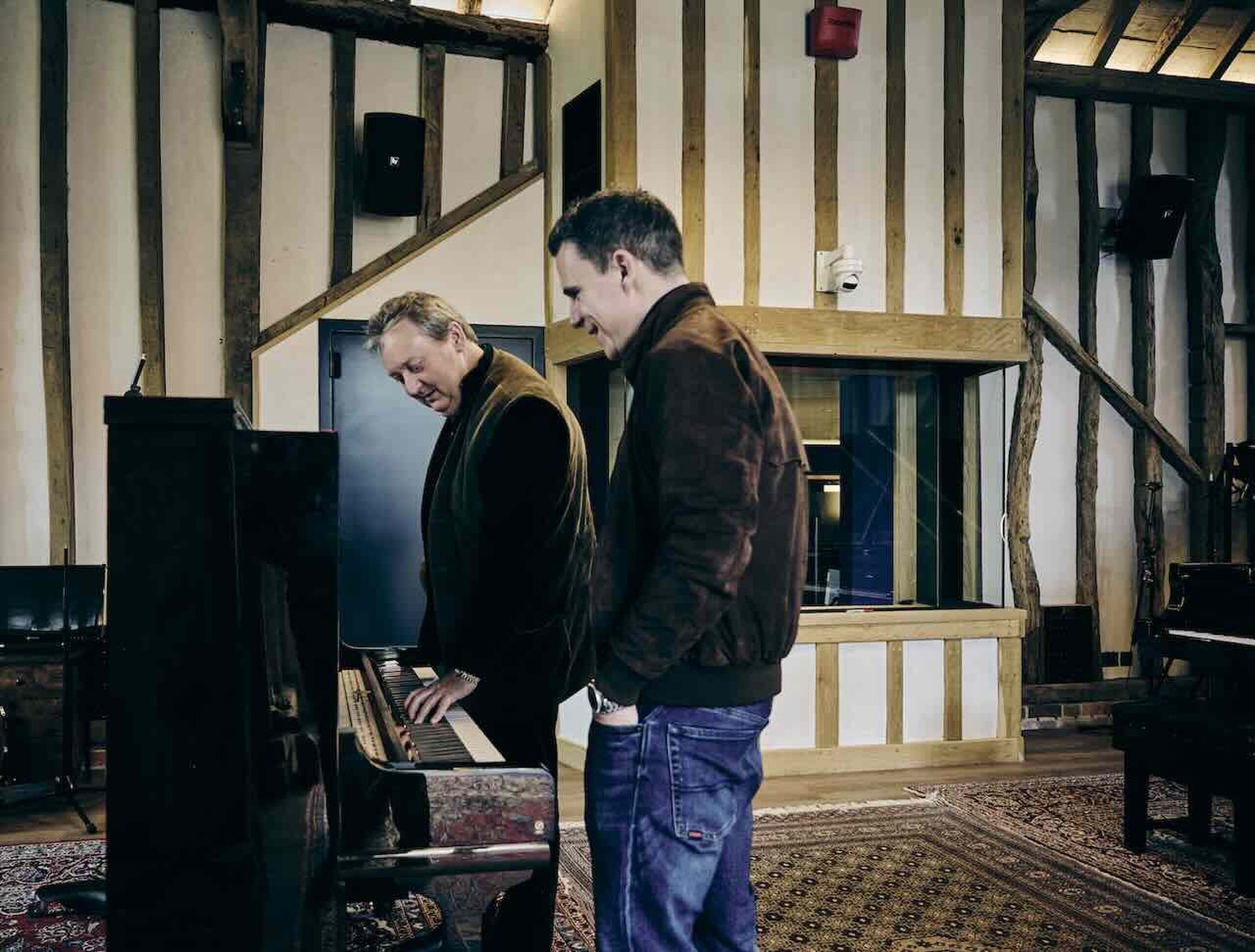 Andrew Sunnucks (L) and pianist Ben Andrew (R) setting up the Yamaha Piano